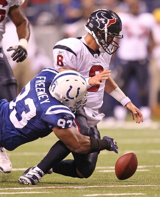 INDIANAPOLIS - NOVEMBER 01:  Matt Schaub #8 of Houston Texans fumbles the ball while being tackled  by Dwight Freeney #93 of the Indianapolis Colts during the NFL game at Lucas Oil Stadium on November 1, 2010 in Indianapolis, Indiana.  (Photo by Andy Lyon
