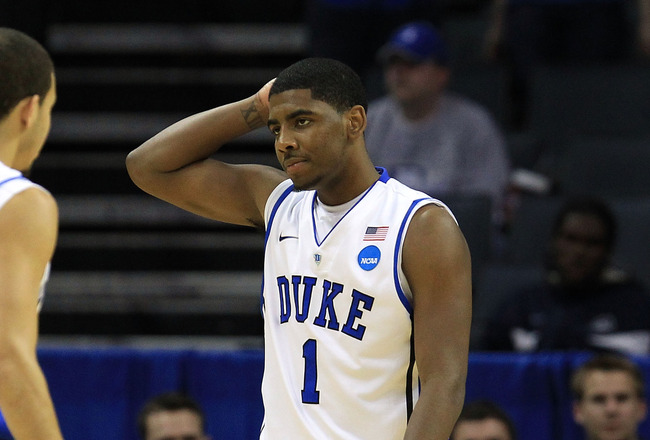 CHARLOTTE, NC - MARCH 20:  Kyrie Irving #1 looks over at teammate Seth Curry #30 of the Duke Blue Devils while taking on the Michigan Wolverines during the third round of the 2011 NCAA men's basketball tournament at Time Warner Cable Arena on March 20, 20