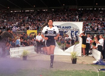 Zinzan Brooke leads the Blues out for the first ever Super Rugby game.