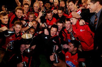 The Crusaders celebrate after an completing an unbeaten season in the 2002 Super 12.