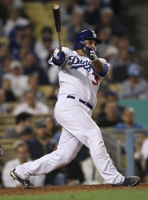 LOS ANGELES, CA - JUNE 20:  Dioner Navarro #30 of  the Los Angeles Dodgers hits an RBI double in the sixth inning against the Detroit Tigers on June 20, 2011 at Dodger Stadium in Los Angeles, California.  (Photo by Stephen Dunn/Getty Images)
