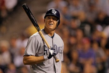DENVER, CO - JUNE 14:  Nick Hundley #4 of the San Diego Padres looks at the scoreboard as he walks to the dugout after striking out in the eighth inning against the Colorado Rockies at Coors Field on June 14, 2011 in Denver, Colorado. The Rockies defeated