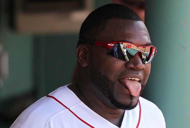 BOSTON, MA  - JULY 24:  David Ortiz #34 of the Boston Red Sox reacts after scoring a run against Seattle Mariners at Fenway Park on July 24, 2011 in Boston, Massachusetts.  (Photo by Jim Rogash/Getty Images)
