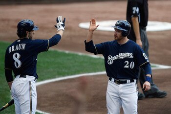 MILWAUKEE, WI - JUNE 26: Jonathan Lucroy #20 of the Milwaukee Brewers is congratulated by Ryan Braun #8 after scoring a run against the Minnesota Twins at Miller Park on June 26, 2011 in Milwaukee, Wisconsin. The Brewers defeated the Twins 6-2. (Photo by