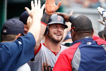 PITTSBURGH - JUNE 26:  Jarod Saltalamacchia #39 of the Boston Red Sox is congratulated by teammates in the dugout after scoring on a throwing error by Andrew McCutchen #22 of the Pittsburgh Pirates during the game on June 26, 2011 at PNC Park in Pittsburg