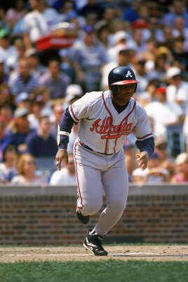 CHICAGO - SEPTEMBER 1:  Terry Pendleton #9 of the Atlanta Braves runs to base during a game against the Chicago Cubs on September 1, 1996 at Wrigley Field in Chicago, Illinois. (Photo by Jonathan Daniel/Getty Images)