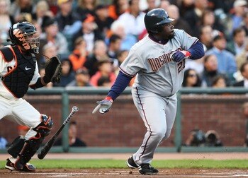 SAN FRANCISCO - AUGUST 06:  Dmitri Young #21 of the Washington Nationals hits a sacrifice fly to make it 1-0 in the first inning against the San Francisco Giants on August 6, 2007 at AT&T Park in San Francisco, California.  (Photo by Jed Jacobsohn/Getty I