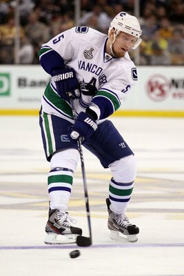 BOSTON, MA - JUNE 06:  Christian Ehrhoff #5 of the Vancouver Canucks skates against the Boston Bruins during Game Three of the 2011 NHL Stanley Cup Final at TD Garden on June 6, 2011 in Boston, Massachusetts.  (Photo by Elsa/Getty Images)