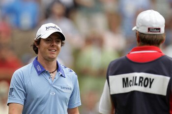 BETHESDA, MD - JUNE 19: Rory McIlroy of Northern Ireland (L) talks with caddie J.P. Fitzgerald (R) during the final round of the 111th U.S. Open at Congressional Country Club on June 19, 2011 in Bethesda, Maryland.  (Photo by Ross Kinnaird/Getty Images)