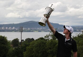BELFAST, NORTHERN IRELAND - JUNE 22:  US Open winning golfer Rory McIlroy poses with his trophy on a green at Holywood Golf Club on June 22, 2011 in Belfast, Northern Ireland. The 22 year old golfer has returned home to his native Northern Ireland and is 
