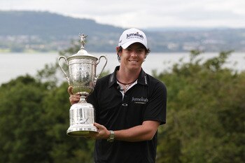 BELFAST, NORTHERN IRELAND - JUNE 22:  US Open winning golfer Rory McIlroy poses with his trophy on a green at Holywood Golf Club on June 22, 2011 in Belfast, Northern Ireland. The 22 year old golfer has returned home to his native Northern Ireland and is 