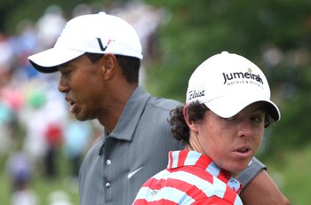DUBLIN, OH - JUNE 02:  Tiger Woods (L) and Rory McIlroy of Northern Ireland wait in a fairway during the Memorial Skins Game prior to the start of the 2010 Memorial Tournament at the Muirfield Village Golf Club on June 2, 2010 in Dublin, Ohio.  (Photo by 
