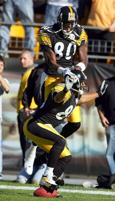 PITTSBURGH - NOVEMBER 7:  Hines Ward #86 of the Pittsburgh Steelers celebrates his touchdown against the Philadelphia Eagles with teammate Plaxico Burress #80 for a 7-0 lead in the first quarter on November 7, 2004 at Heinz Field in Pittsburgh, Pennsylvan