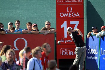 DUBAI, UNITED ARAB EMIRATES - FEBRUARY 13:  Rory McIlroy of Northern Ireland plays his tee shot at the 17th hole during the final round of the 2011 Omega Dubai Desert Classic on the Majilis Course at the Emirates Golf Club on February 13, 2011 in Dubai, U
