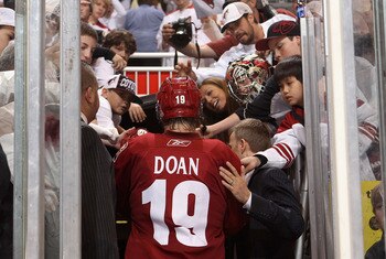 GLENDALE, AZ - APRIL 20:  Shane Doan #19 of the Phoenix Coyotes walks off the ice after being defeated by the Detroit Red Wings in Game Four of the Western Conference Quarterfinals during the 2011 NHL Stanley Cup Playoffs at Jobing.com Arena on April 20, 