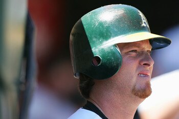 OAKLAND, CA - JUNE 30:  Scott Hatteberg #10 of the Oakland Athletics looks on during the MLB game against the Seattle Mariners at McAfee Coliseum on June 30, 2005 in Oakland, California. (Photo by Jed Jacobsohn/Getty Images)