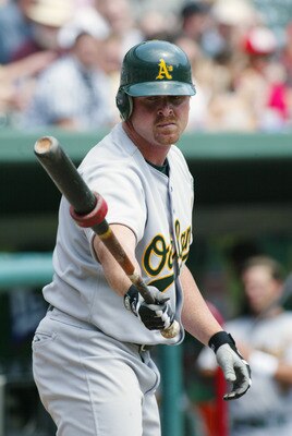 ARLINGTON, TEXAS - APRIL 11:  Left fielder Jeremy Giambi #7 of the Oakland Athletics warms up in the on deck circle during the MLB game against the Texas Rangers at The Ballpark in Arlington, Texas on April 11, 2002. The Rangers won 7-0. (Photo by Ronald