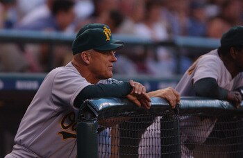 SEATTLE - JUNE 25:  Manager Art Howe #18 of the Oakland A's looks on from the dugout against the Seattle Mariners during the game at Safeco Field in Seattle, Washington on June 25, 2002.  The Mariners beat the A's 7-1.  (Photo by Otto Greule Jr/Getty Imag