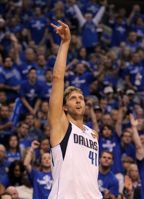 DALLAS, TX - JUNE 05:  Dirk Nowitzki #41 of the Dallas Mavericks follows through after taking a three-pointer while taking on the Miami Heat in Game Three of the 2011 NBA Finals at American Airlines Center on June 5, 2011 in Dallas, Texas.  NOTE TO USER: