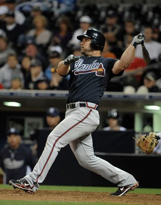 SAN DIEGO, CA - JUNE 25: Dan Uggla #26 of the Atlanta Braves connects for a three-run homer during the ninth inning of a baseball game against the San Diego Padres at Petco Park on June 25, 2011 in San Diego, California. The Braves won 10-1.  (Photo by De