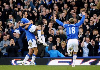 LIVERPOOL, ENGLAND - MARCH 07: Landon Donovan of Everton is lifted in the air by Jack Rodwell after scoring the fourth goal during the Barclays Premier League match between Everton and Hull City at Goodison Park on March 7, 2010 in Liverpool, England.  (P
