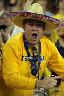 GLENDALE, AZ - JANUARY 02:  A West Virginia Mountaineers fan yells during the Mountaineers game against the Oklahoma Sooners at the Tostito's Fiesta Bowl at University of Phoenix Stadium January 2, 2008 in Glendale, Arizona.  (Photo by Doug Pensinger/Gett