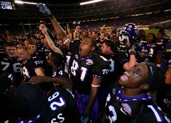 SAN DIEGO, CA - DECEMBER 23:  Wide Receiver Antoine  Hicks #13 of the TCU Horned Frogs and the rest of his teammates celebrate their 17-16 win over Boise State Broncos during the San Diego County Credit Union Poinsettia Bowl at Qualcomm Stadium on Decembe