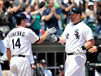 CHICAGO, IL - JUNE 12: Adam Dunn #32 of the Chicago White Sox gets congratulated by Paul Konerko # 14 after hitting a 3-run homer against the Oakland Athletics on June 12, 2011 at U.S. Cellular Field in Chicago, Illinois.  (Photo by David Banks/Getty Imag