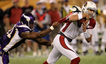MINNEAPOLIS - NOVEMBER 7: Defensive end Ray Edwards #91 of the Minnesota Vikings grabs the jersey of quarterback Derek Anderson #3 of the Arizona Cardinals at Hubert H. Humphrey Metrodome on November 7, 2010 in Minneapolis, Minnesota.  The Vikings won 27-