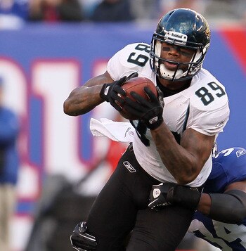EAST RUTHERFORD, NJ - NOVEMBER 28: Marcedes Lewis #89 of the Jacksonville Jaguars tries to break out of a tackle against the New York Giants at New Meadowlands Stadium on November 28, 2010 in East Rutherford, New Jersey.  (Photo by Chris McGrath/Getty Ima