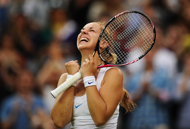 LONDON, ENGLAND - JUNE 23:  Sabine Lisicki of Germany celebrates after winning her second round match against Na Li of China on Day Four of the Wimbledon Lawn Tennis Championships at the All England Lawn Tennis and Croquet Club on June 23, 2011 in London,