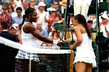LONDON, ENGLAND - JUNE 27:  Marion Bartoli of France (R) shakes hands with Serena Williams of the United States after winning her fourth round match on Day Seven of the Wimbledon Lawn Tennis Championships at the All England Lawn Tennis and Croquet Club on