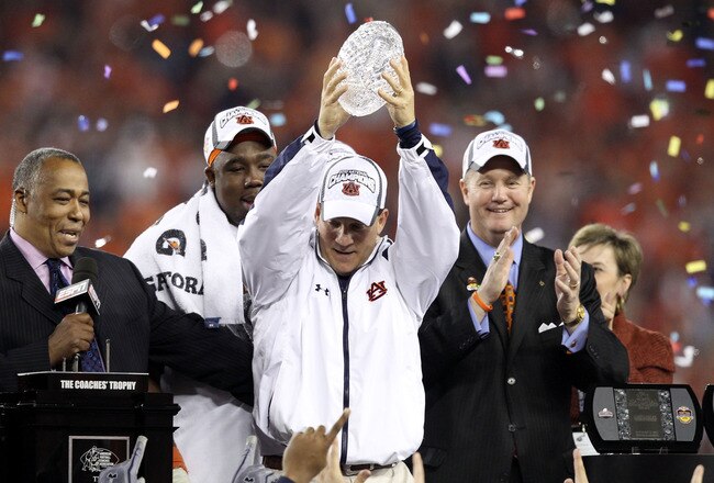 GLENDALE, AZ - JANUARY 10:  Head coach Gene Chizik of the Auburn Tigers celebrates the Tigers 22-19 victory against the Oregon Ducks during the Tostitos BCS National Championship Game at University of Phoenix Stadium on January 10, 2011 in Glendale, Arizo