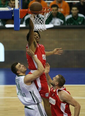 BERLIN - MAY 01:  Nikola Pekovic, Josh Childress and Nikola Vujcic (L-R) challenge for the ball during the Euroleague Basketball Final Four Semi Final game between Olympiacos Piraeus and Panathinaikos Athen at O2 World on May 1, 2009 in Berlin, Germany.  