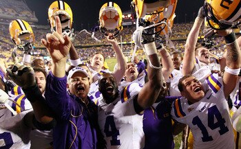 Head Coach Les Miles celebrates with his team