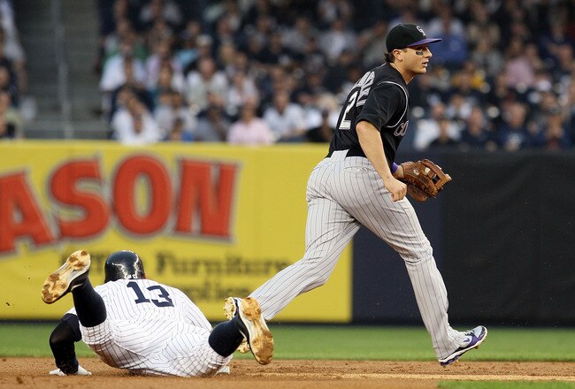 NEW YORK, NY - JUNE 24:  Alex Rodriguez #13 of the New York Yankees is doubled up in the first inning by Troy Tulowitzki #2 of the Colorado Rockies on June 24, 2011 at Yankee Stadium in the Bronx borough of New York City.  (Photo by Jim McIsaac/Getty Imag