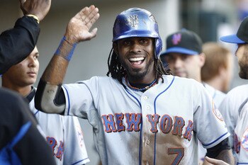 DETROIT, MI - JUNE 29:  Jose Reyes #7 of the New York Mets is congratulated after scoring the first run of the game against the Detroit Tigers on June 29, 2011 at Comerica Park in Detroit, Michigan.  (Photo by John Grieshop/Getty Images)