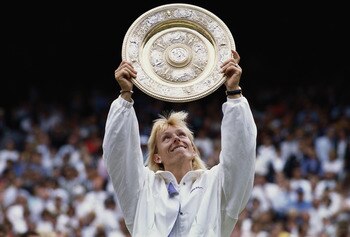 Martina Navratilova holds aloft the Venus Rosewater Dish after defeating  Zina Garrison in their Women's Singles Final match at the Wimbledon Lawn Tennis Championship on 7th July 1990 at the All England Lawn Tennis and Croquet Club in Wimbledon in London,