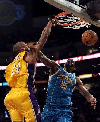 LOS ANGELES, CA - APRIL 26:  Kobe Bryant #24 of the Los Angeles Lakers dunks the ball over Emeka Okafor #50 of the New Orleans Hornets in the second quarter in Game Five of the Western Conference Quarterfinals in the 2011 NBA Playoffs on April 26, 2011 at