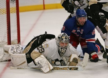 NEW YORK - MARCH 31: Jaromir Jagr #68 of the New York Rangers crashes the net against Marc-Andre Fleury #29 of the Pittsburgh Penguins on March 31, 2008 at Madison Square Garden in New York City. The Rangers defeated the Penguins 2-1 in overtime.  (Photo