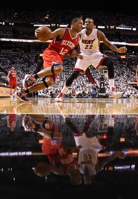 MIAMI, FL - APRIL 27:  Evan Turner #12 of the Philadelphia 76ers drives past James Jones #22 of the Miami Heat during game five of the Eastern Conference Quarterfinals in the 2011 NBA Playoffs at American Airlines Arena on April 27, 2011 in Miami, Florida