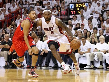 MIAMI, FL - APRIL 27:  LeBron James #6 of the Miami Heat drives by Evan Turner #12 of the Philadelphia 76ers during game five of the Eastern Conference Quarterfinals in the 2011 NBA Playoffs at American Airlines Arena on April 27, 2011 in Miami, Florida.