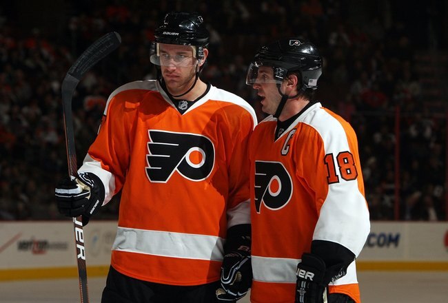 PHILADELPHIA - DECEMBER 21:  Mike Richards #18 and Jeff Carter #17 of the Philadelphia Flyers look on against the Florida Panthers on December 21, 2009 at Wachovia Center in Philadelphia, Pennsylvania. The Panthers defeated the Flyers 4-1.  (Photo by Jim