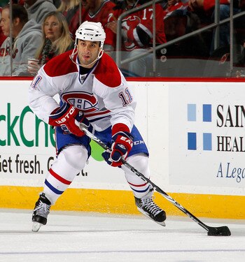 NEWARK, NJ - APRIL 02:  Scott Gomez #11 of the Montreal Canadians skates during an NHL hockey game against the New Jersey Devils at the Prudential Center on April 2, 2011 in Newark, New Jersey.  (Photo by Paul Bereswill/Getty Images)