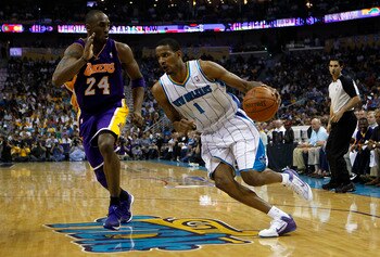 NEW ORLEANS, LA - APRIL 24:  Trevor Ariza #1 of the New Orleans Hornets drives around Kobe Bryant #24 of the Los Angeles Lakers in Game Four of the Western Conference Quarterfinals in the 2011 NBA Playoffs at New Orleans Arena on April 24, 2011 in New Orl