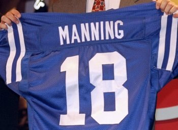 18 Apr 1998:  First overall pick Peyton Manning shows off his jersey after being selected by the Indianapolis Colts in the first round of the 1998 NFL Draft at Madison Square Garden in Manhattan, New York. Mandatory Credit: Ezra C. Shaw  /Allsport