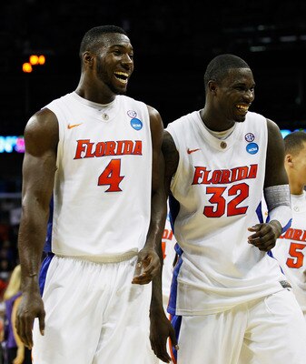 NEW ORLEANS, LA - MARCH 24:  Patric Young #4 and Vernon Macklin #32 of the Florida Gators celebrate durig their 83 to 74 win over the Brigham Young Cougars during the Southeast regional of the 2011 NCAA men's basketball tournament at New Orleans Arena on
