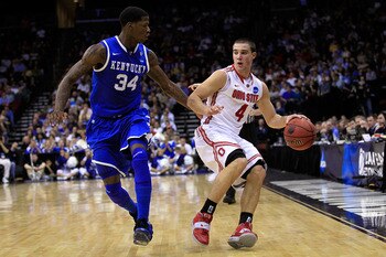 NEWARK, NJ - MARCH 25:  Aaron Craft #4 of the Ohio State Buckeyes brings the ball up court against DeAndre Liggins #34 of the Kentucky Wildcats during the east regional semifinal of the 2011 NCAA Men's Basketball Tournament at the Prudential Center on Mar