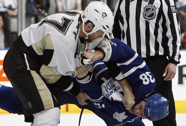 TORONTO, CANADA - FEBRUARY 26: Jay Rosehill #38 of the Toronto Maple Leafs fights Mike Rupp #17 of the Pittsburgh Penguins during game action at the Air Canada Centre February 26, 2011 in Toronto, Ontario, Canada. (Photo by Abelimages/Getty Images)