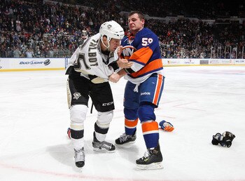 UNIONDALE, NY - FEBRUARY 11:  Michael Haley #59 of the New York Islanders fights Maxime Talbot #25 of the Pittsburgh Penguins in the third period on February 11, 2011 at Nassau Coliseum in Uniondale, New York. The Isles defeated the Pens 9-3.  (Photo by J